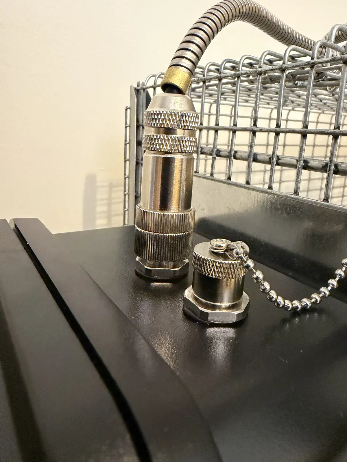 The motor cable connector screwed onto the POD, next to the capped accessory port