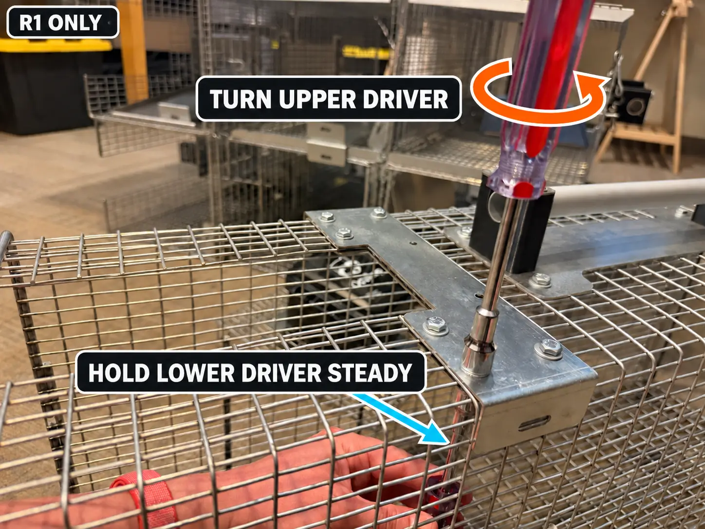 Turn the upper nut driver while holding the lower driver steady