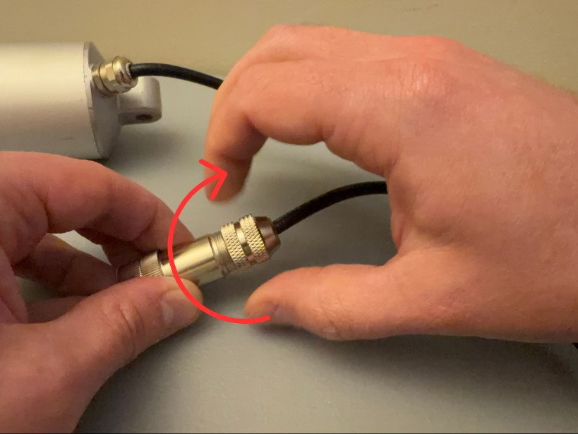 Tighten the connector clockwise while holding the cable in place