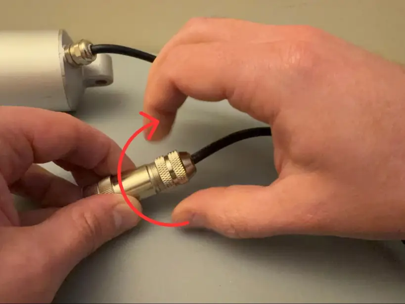 Tighten the connector clockwise while holding the cable in place